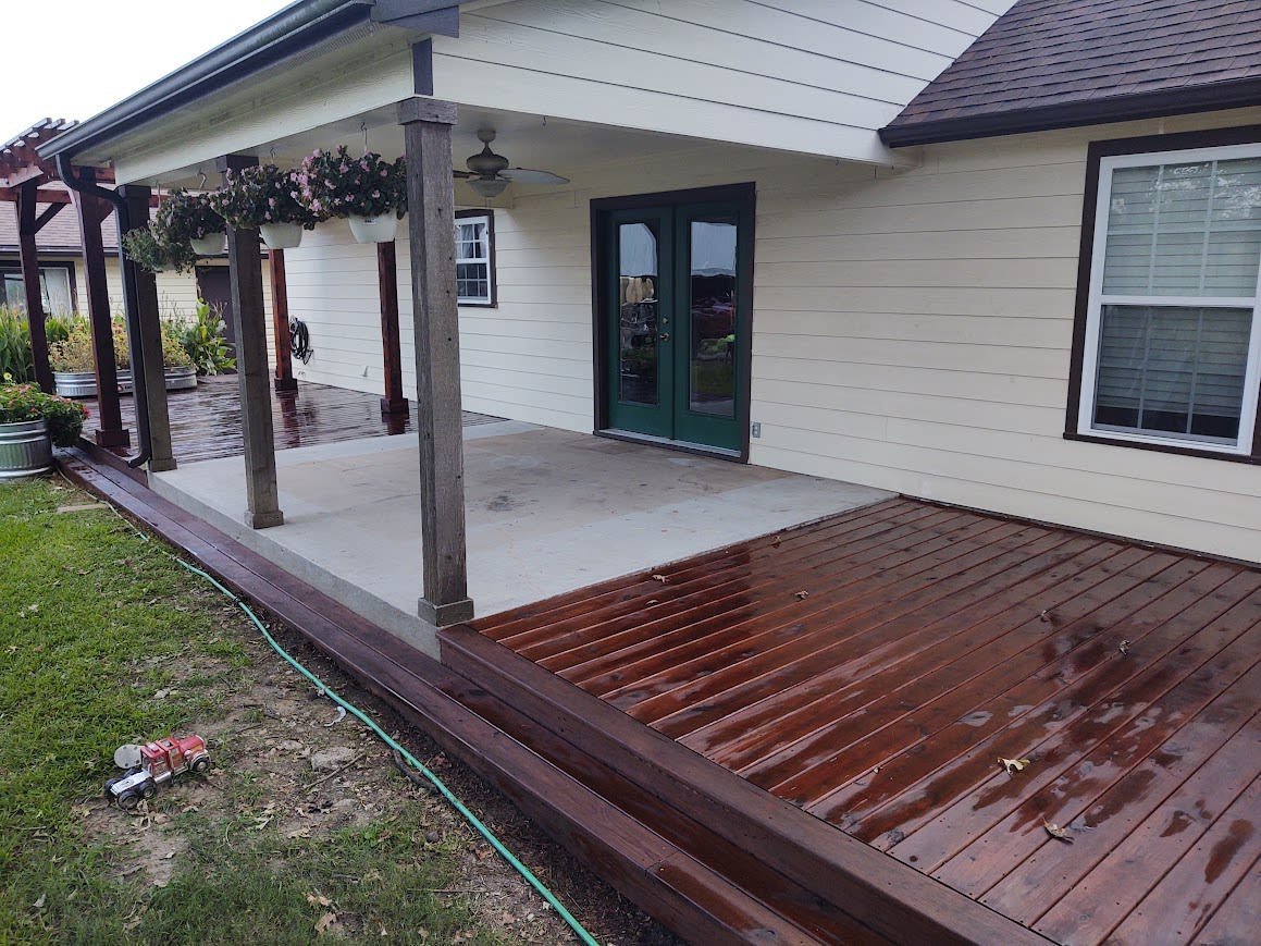 Stained wooden deck with outdoor seating area