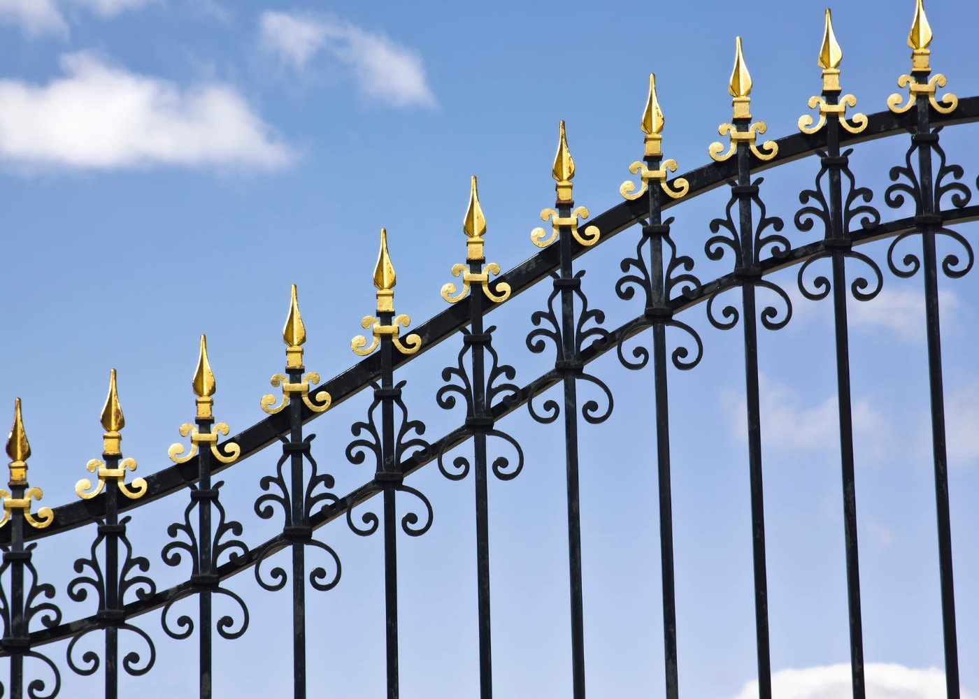 Black wrought iron fence with decorative posts